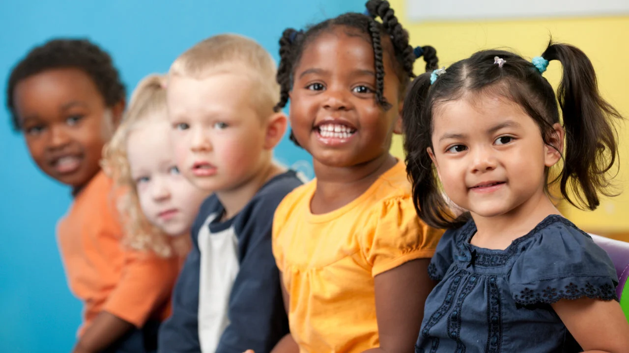 Preschool children smiling together at Next Level Weekday Preschool