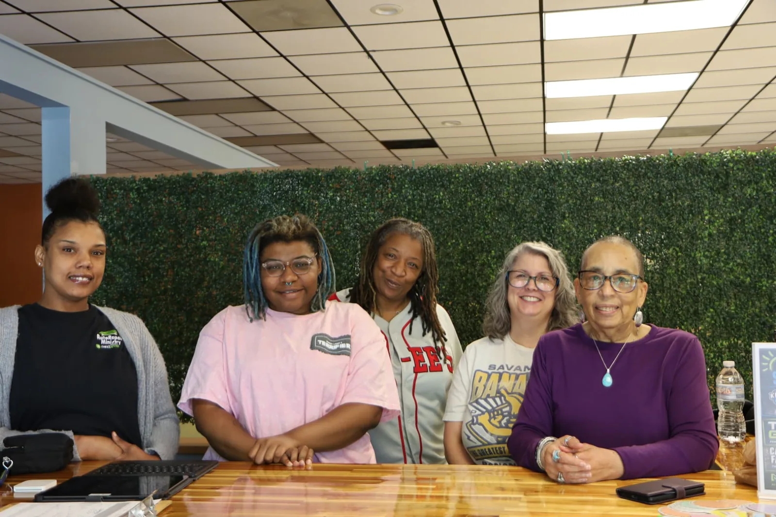 The auto repair ministry check-in team behind the counter