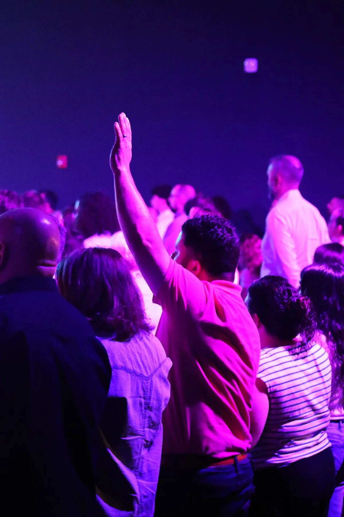 A guest participating in worship