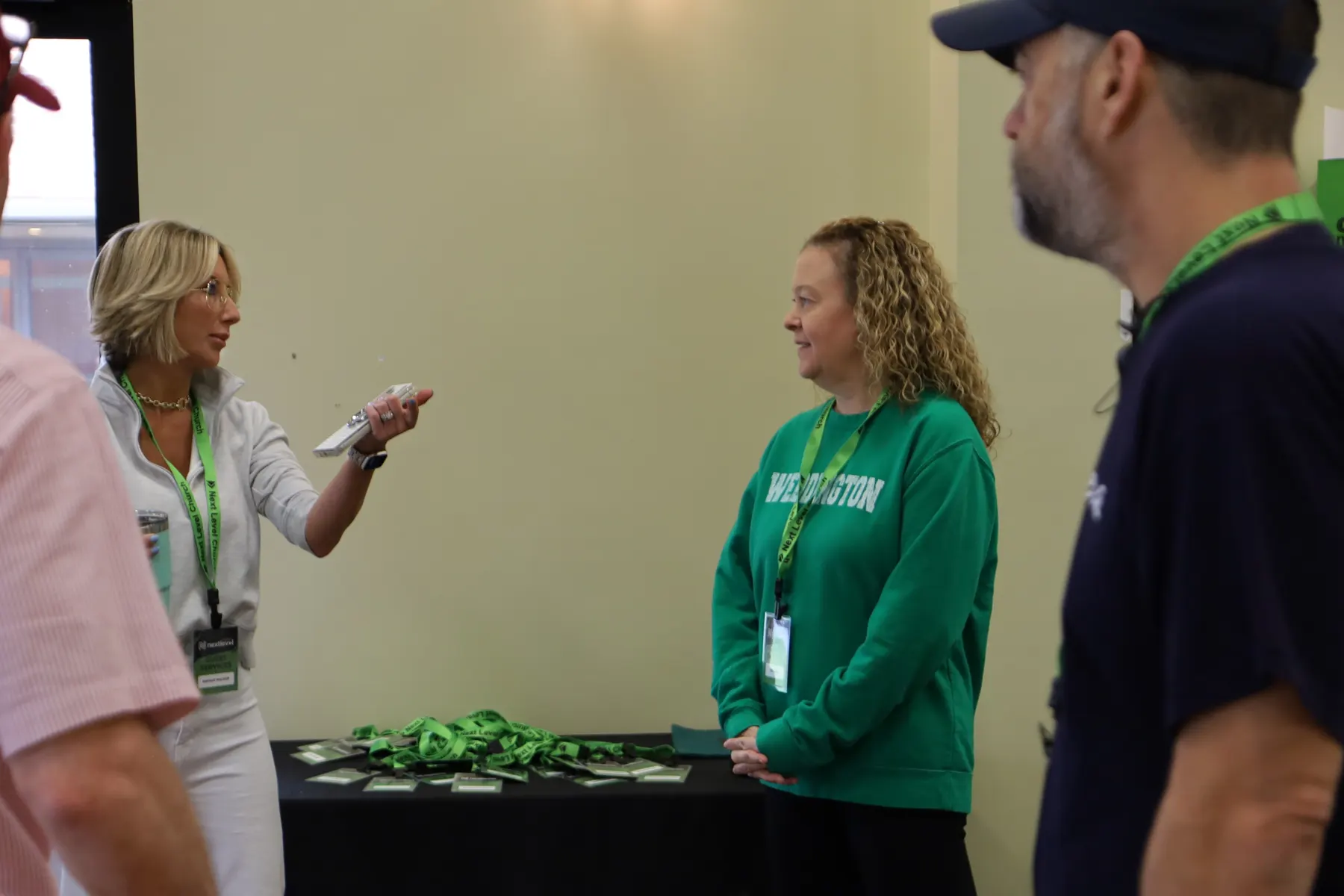 Friendly greeters at the Next Level Church welcome table